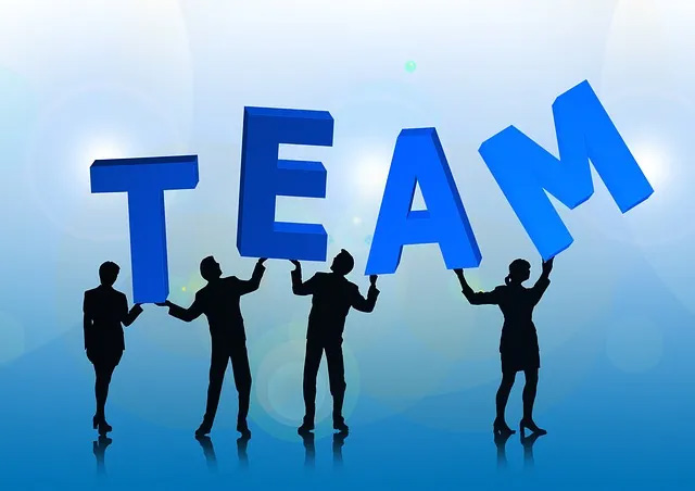 Team illustartion av personer som håller i ordet team